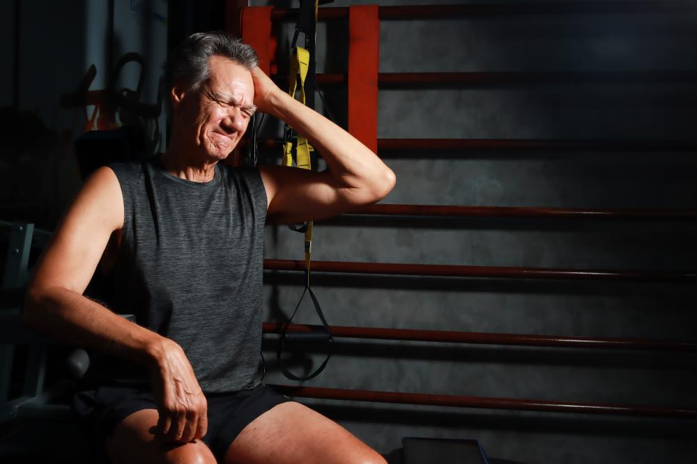 Senior man at gym representing fitness during prostate cancer recovery