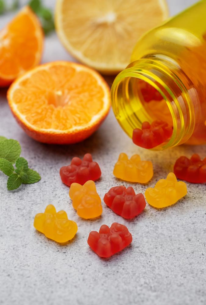 CBD gummies and fresh oranges for a natural wellness journey