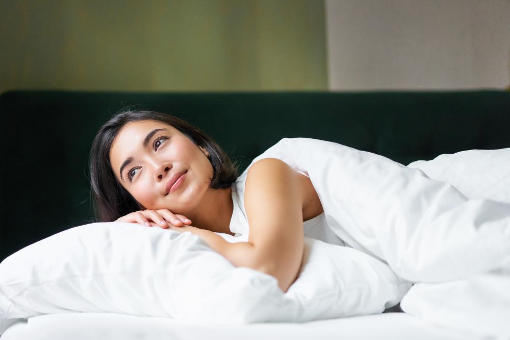 Asian girl resting peacefully symbolizing the effect of CBD for sleep