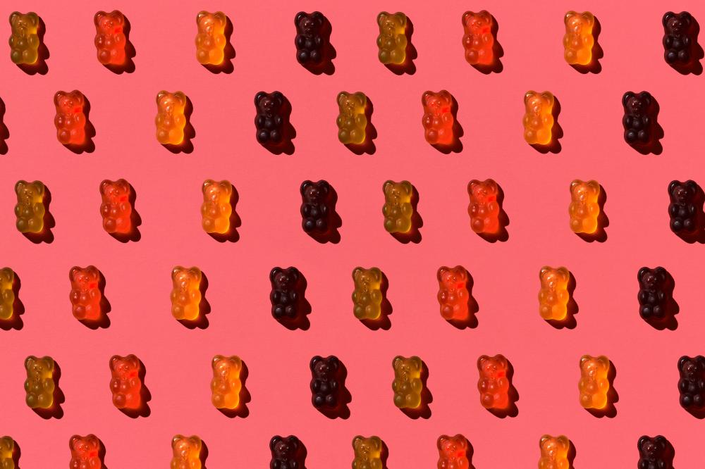 Colorful jelly bears pattern representing the variety of CBD gummies for weight loss
