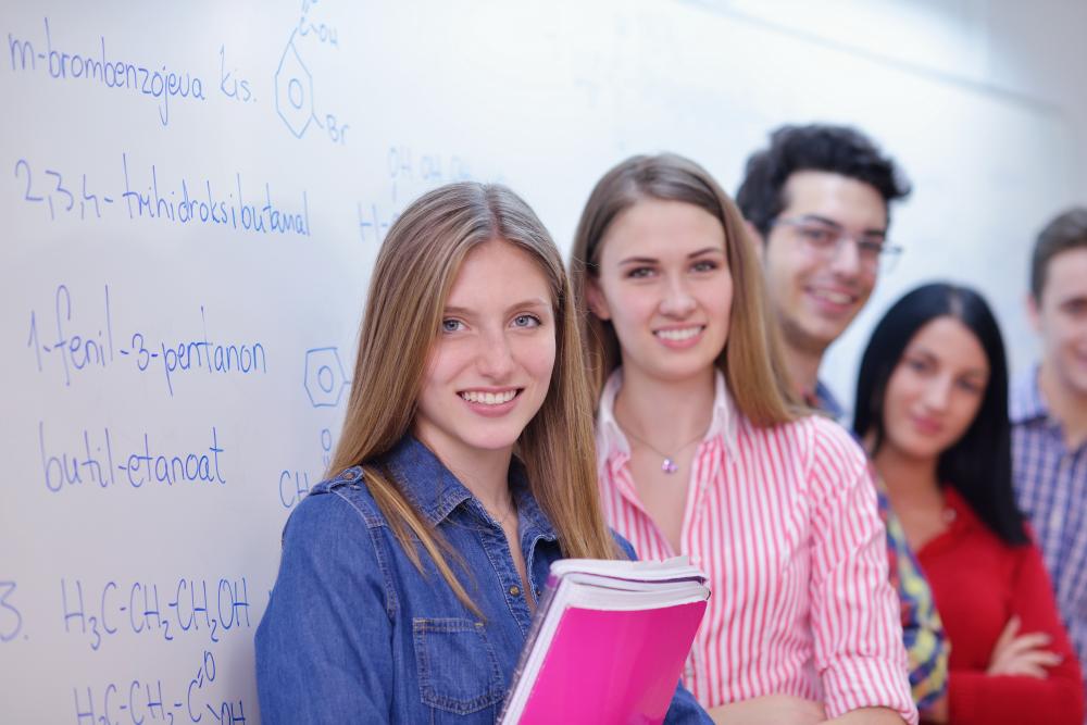 Smiling teens in a learning environment showcasing tutoring success