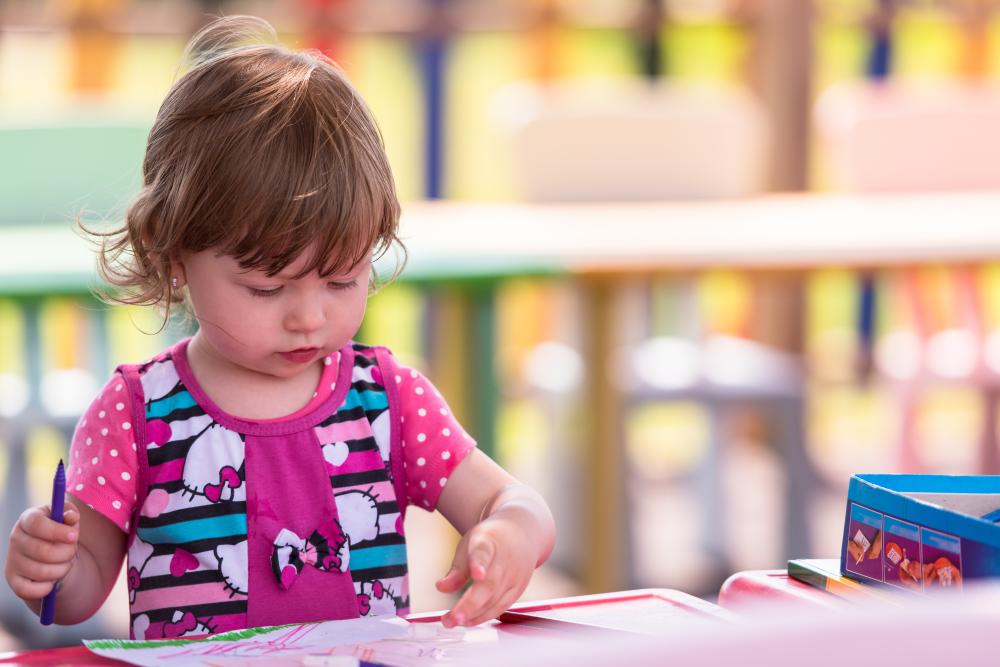 Young Artist Expressing Creativity in Daycare Setting