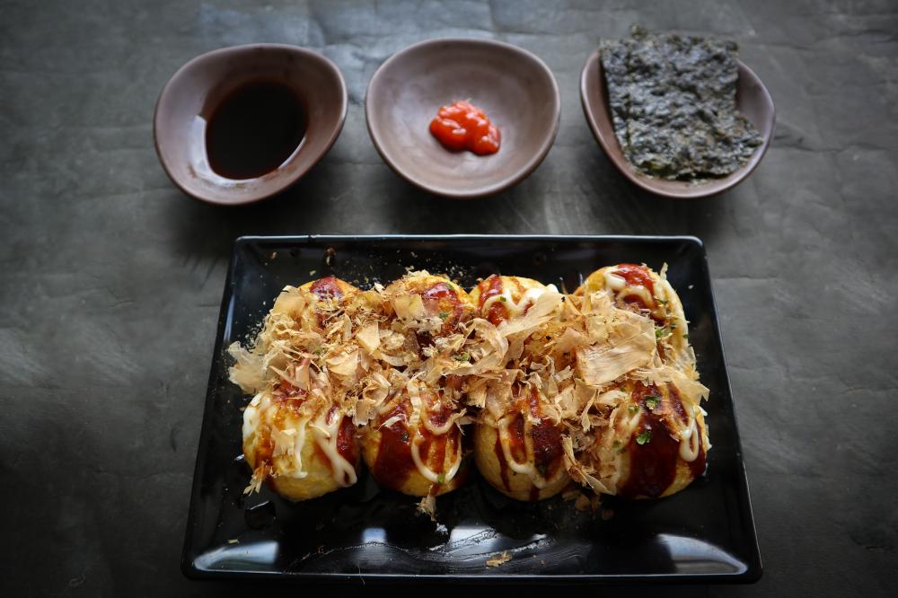 Authentic Takoyaki Dish Representing Asian Fusion Cuisine in San Antonio