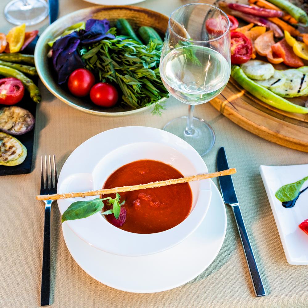 Red tomato soup with Greek culinary style, echoing sustainable dining practices in Baltimore