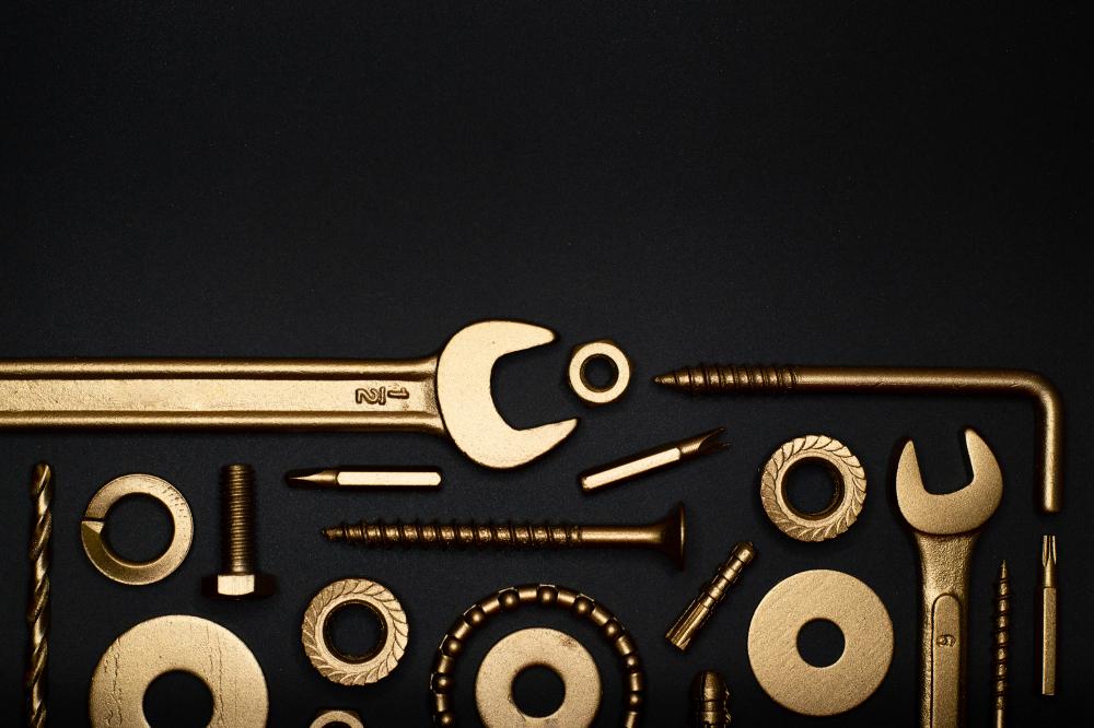 Assortment of precision tools on a black background highlighting the versatility of taladro columna
