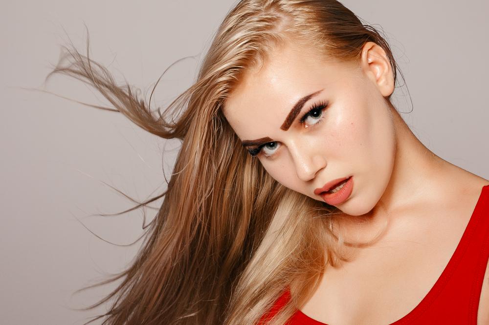 Beautiful Blonde Model with Healthy Long Hair Illustrating Haircare Excellence