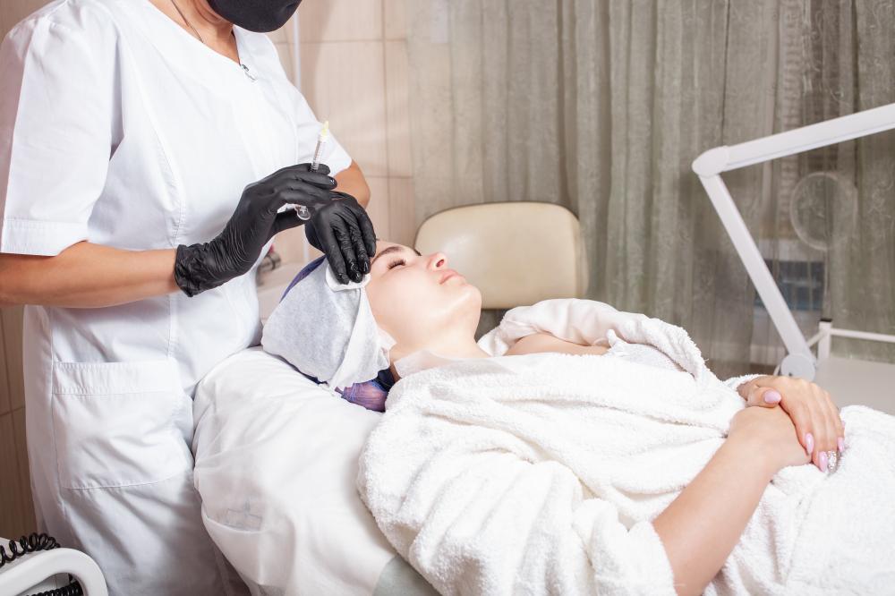Beautician conducting mesotherapy, representing precision in microblading courses