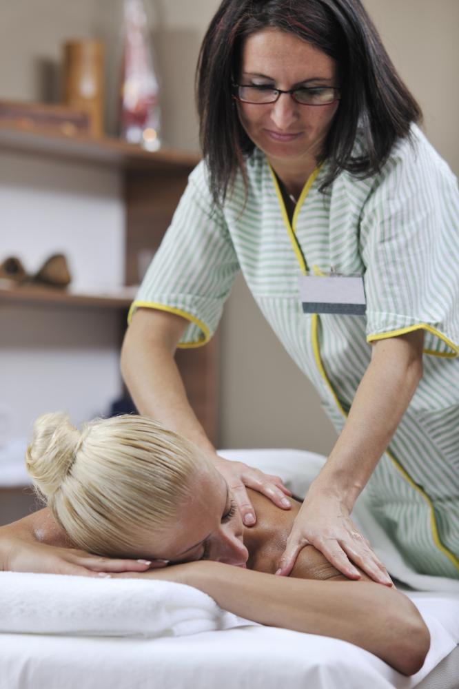 Expert massage therapist applying healing techniques