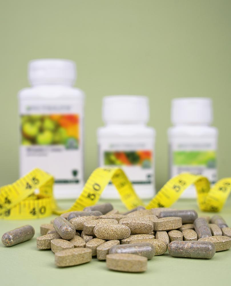 Array of natural vitamins and supplements for weight management