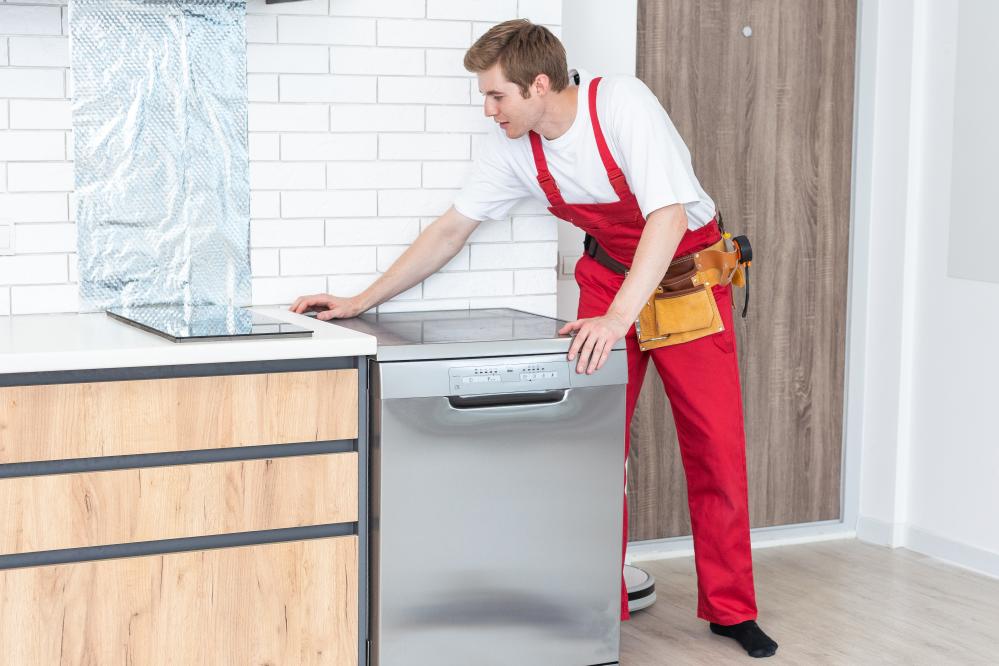 Expert technician fixing home appliances for appliance repair service in Thornton