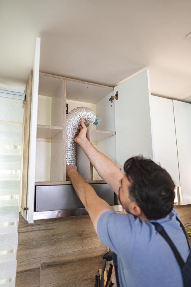 vecteezy technician installing ventilation pipe in kitchen cabinet 68904154 729
