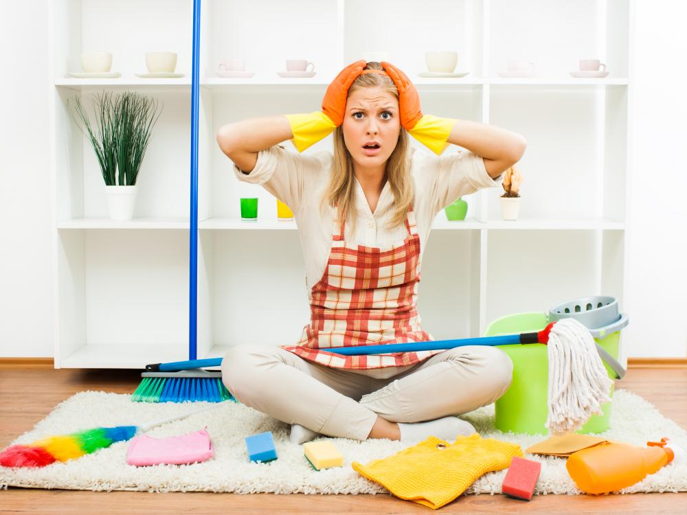 Overwhelmed homeowner realizing the need for deep cleaning