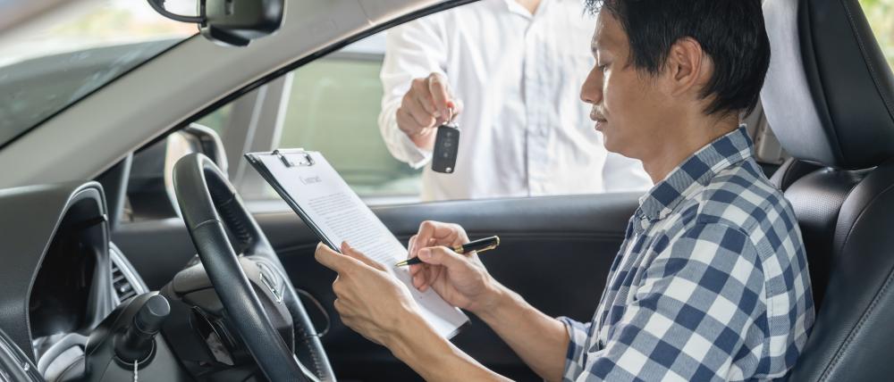 Smartphone with commercial vehicle insurance options on screen