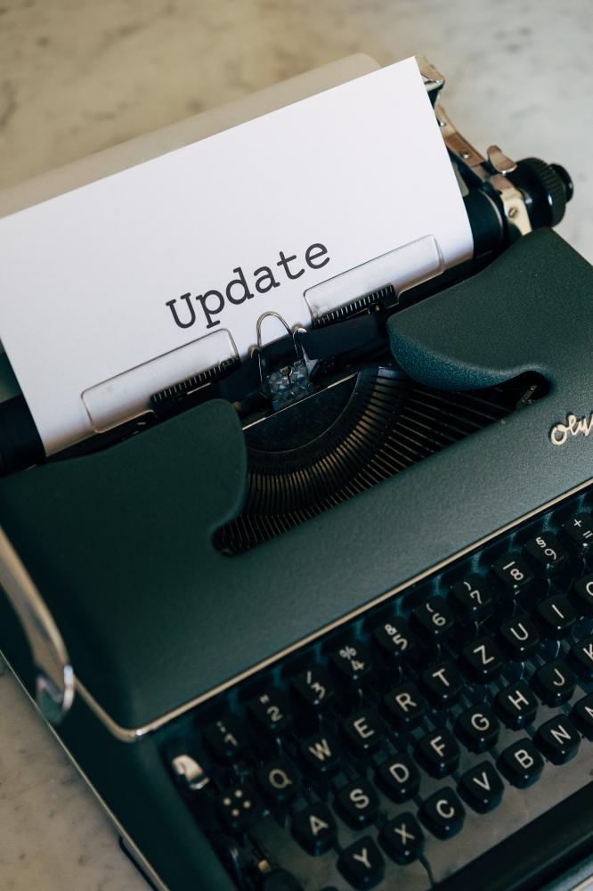 Vintage typewriter with 'Update' typed, symbolizing content refreshness