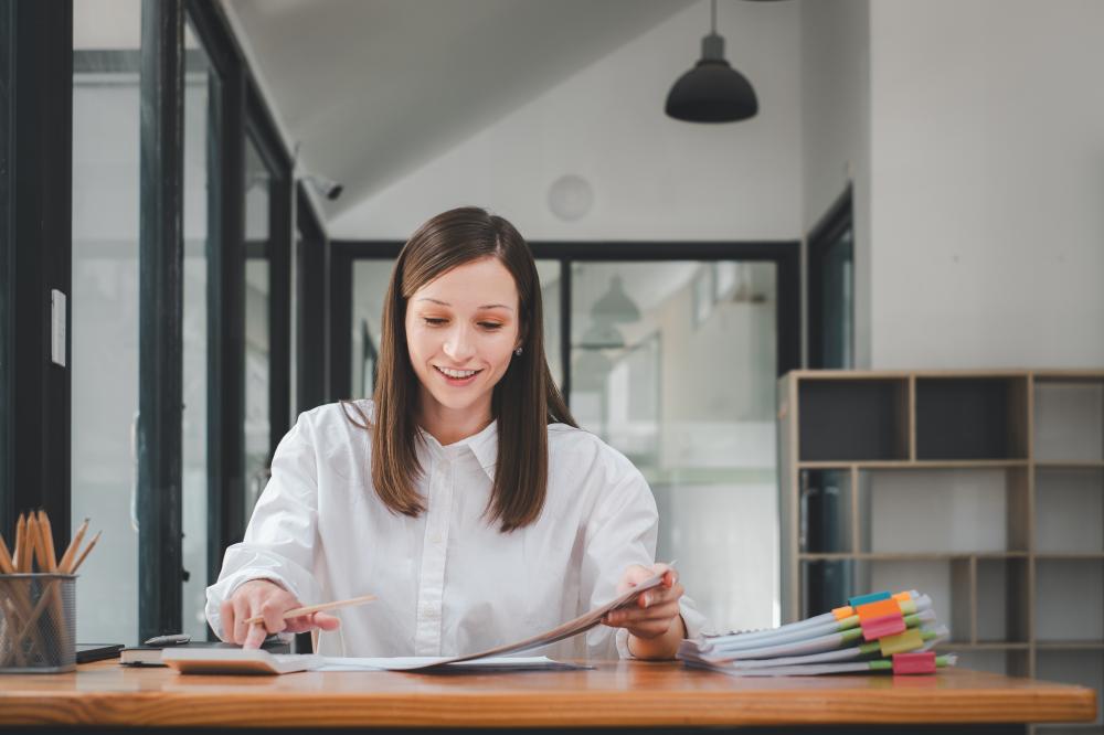 Business Woman Analyzing Financial Documents