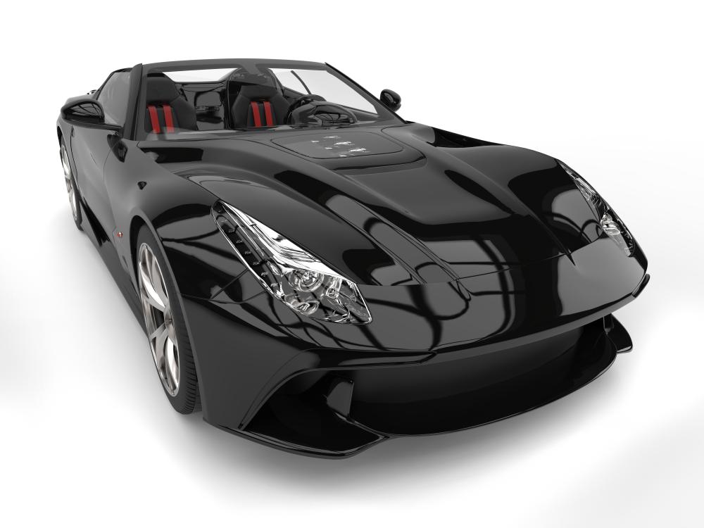 Sleek black modern convertible sports car representing luxury transportation